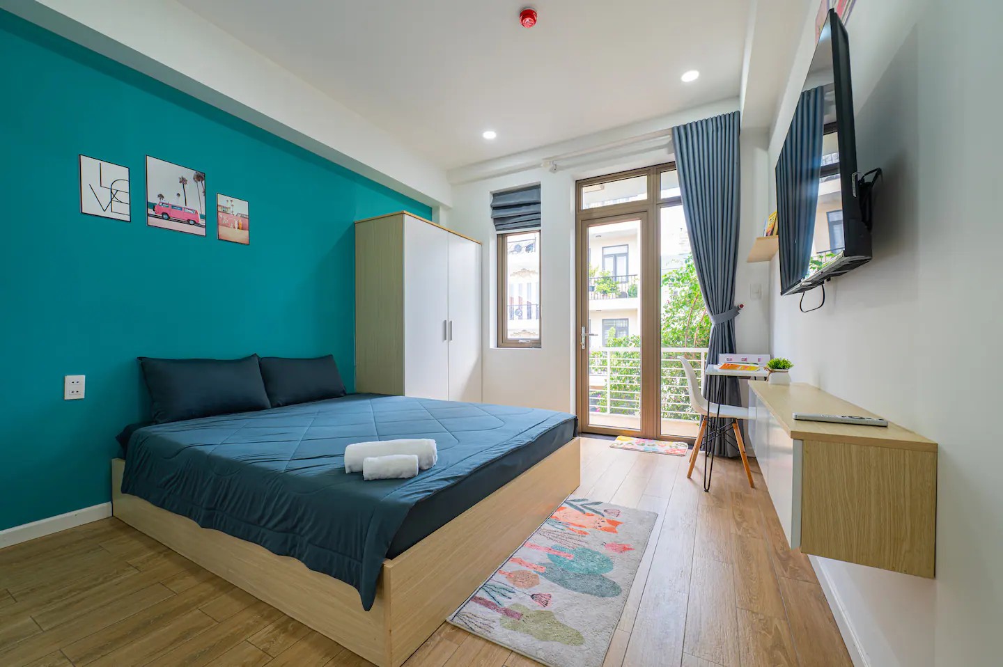 Studio R2.2 interior with queen bed and kitchenette